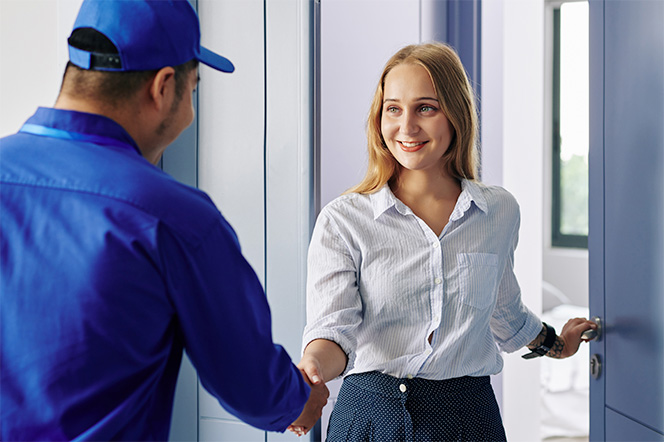 customer shaking hands with electrician