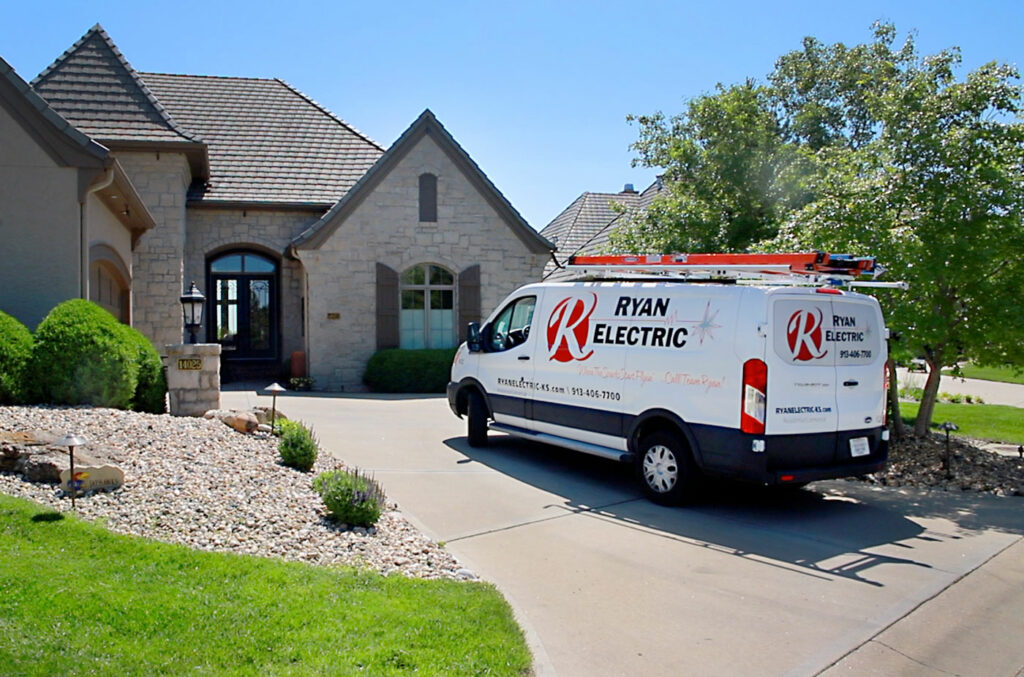 Ryan Electric truck parked outside of a customer's home